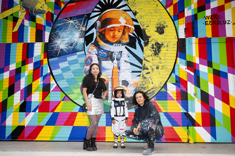 NASA Art Program Relaunch: Artist team Geraluz and WERC pose with their son, Amaru Alvarez, in front of the To the Moon, and Back mural, 350 Hudson Street, New York City, NY, USA. NASA/Joel Kowsky.
