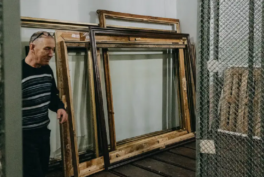 Photograph of space in the museum with empty painting frames after the looting.